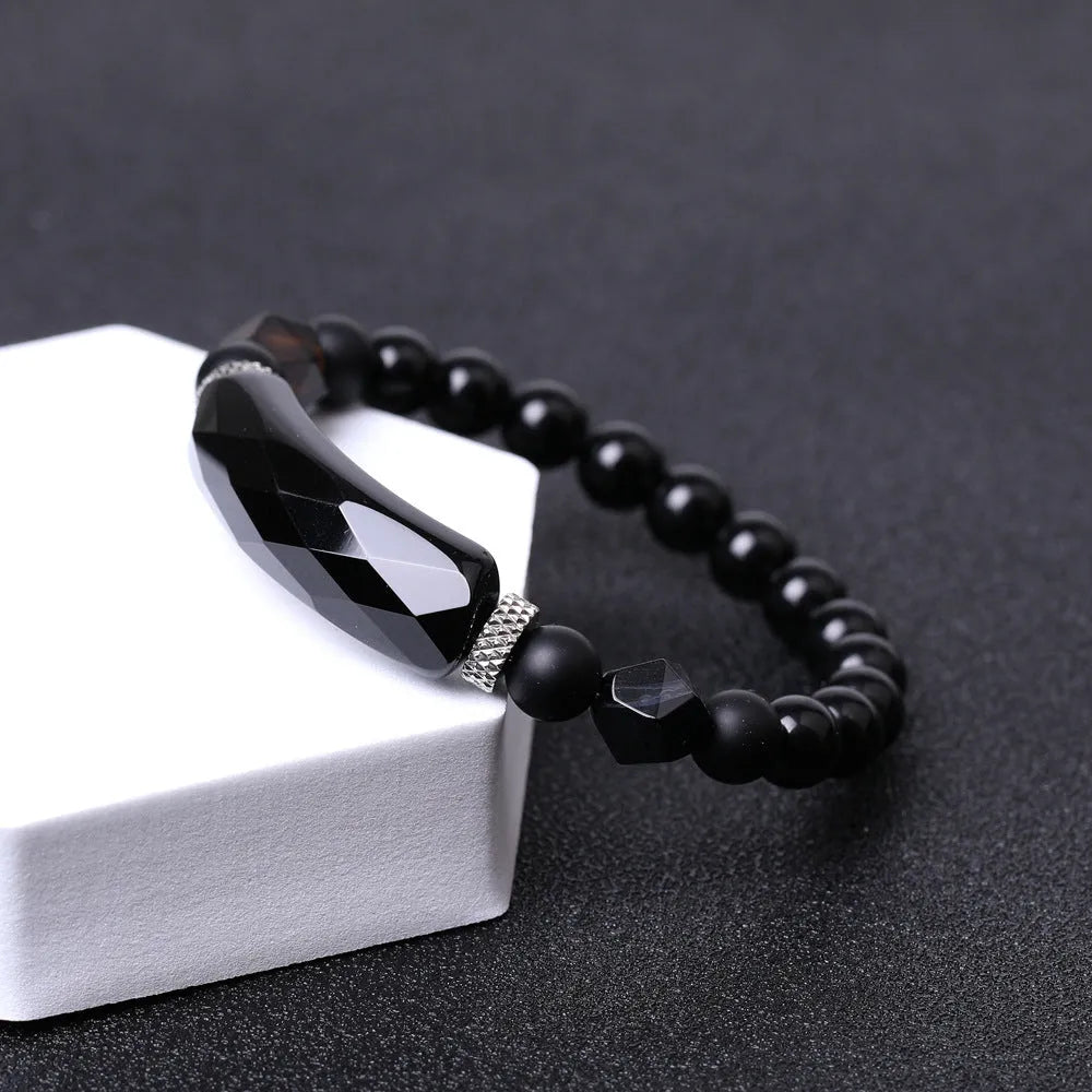 Handmade diamond-shaped cut black agate bracelet with fan-shaped design elements