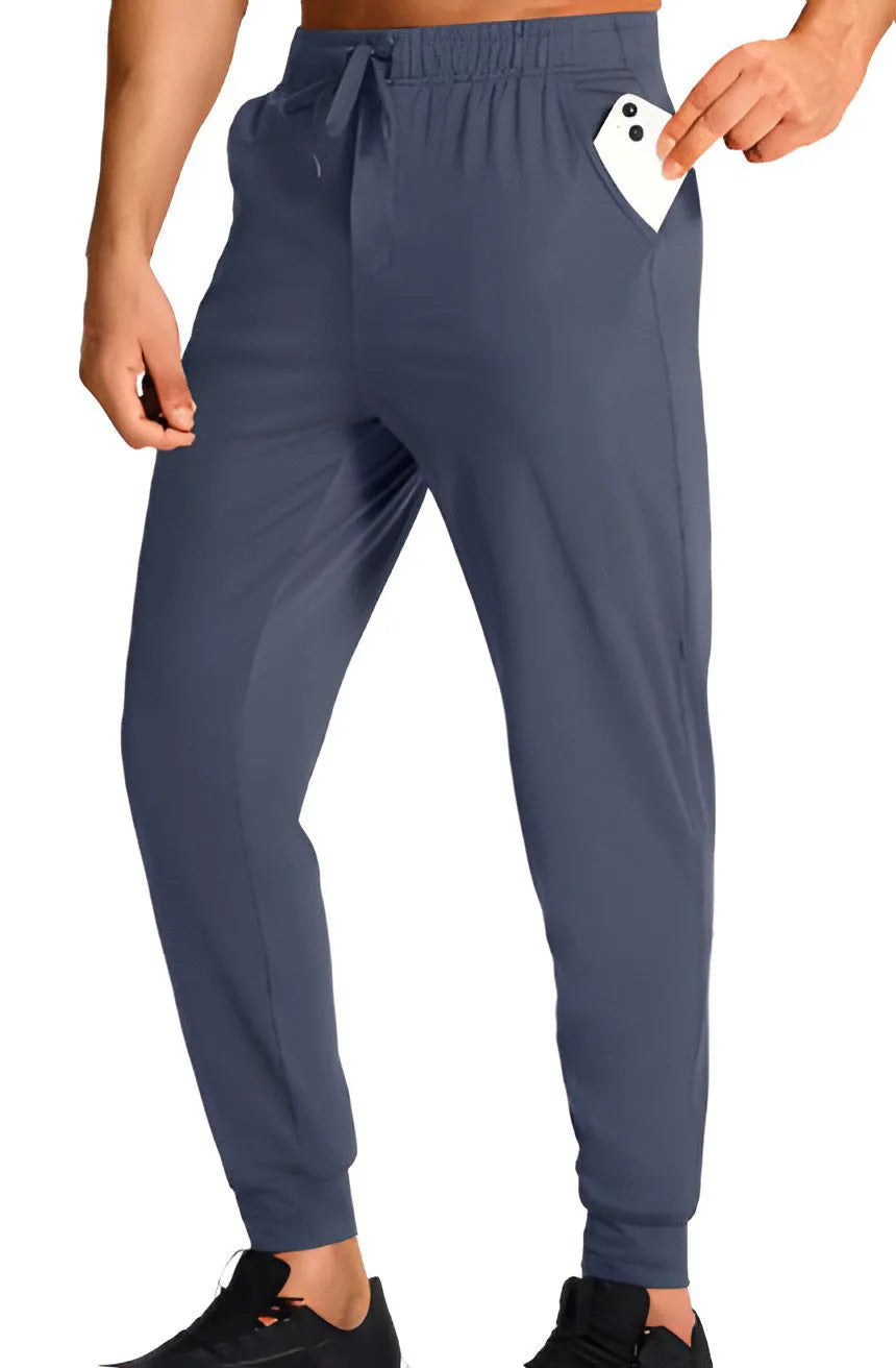 Men's loose casual trousers in solid colour, made from 100% polyester fabric, available in multiple sizes and shades for leisure wear