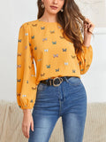 Women's butterfly print long-sleeved shirt in green colour showing loose fit and regular sleeves
