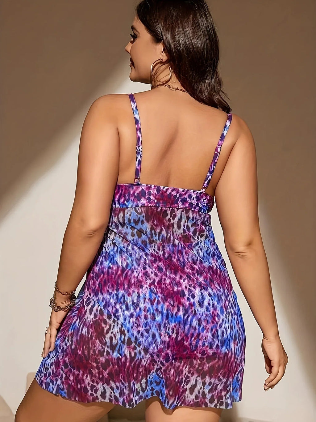 Plus size split bikini set with sleeveless top and shorts for swimming, available in red, rose red, blue, and purple colours.