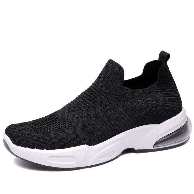 Slip-on sock shoes with mesh lining and PVC sole in black, white, pink, and khaki colours