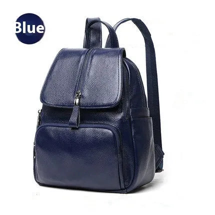 Solid colour genuine leather women's backpack showing blue exterior with multiple compartments and internal organisation