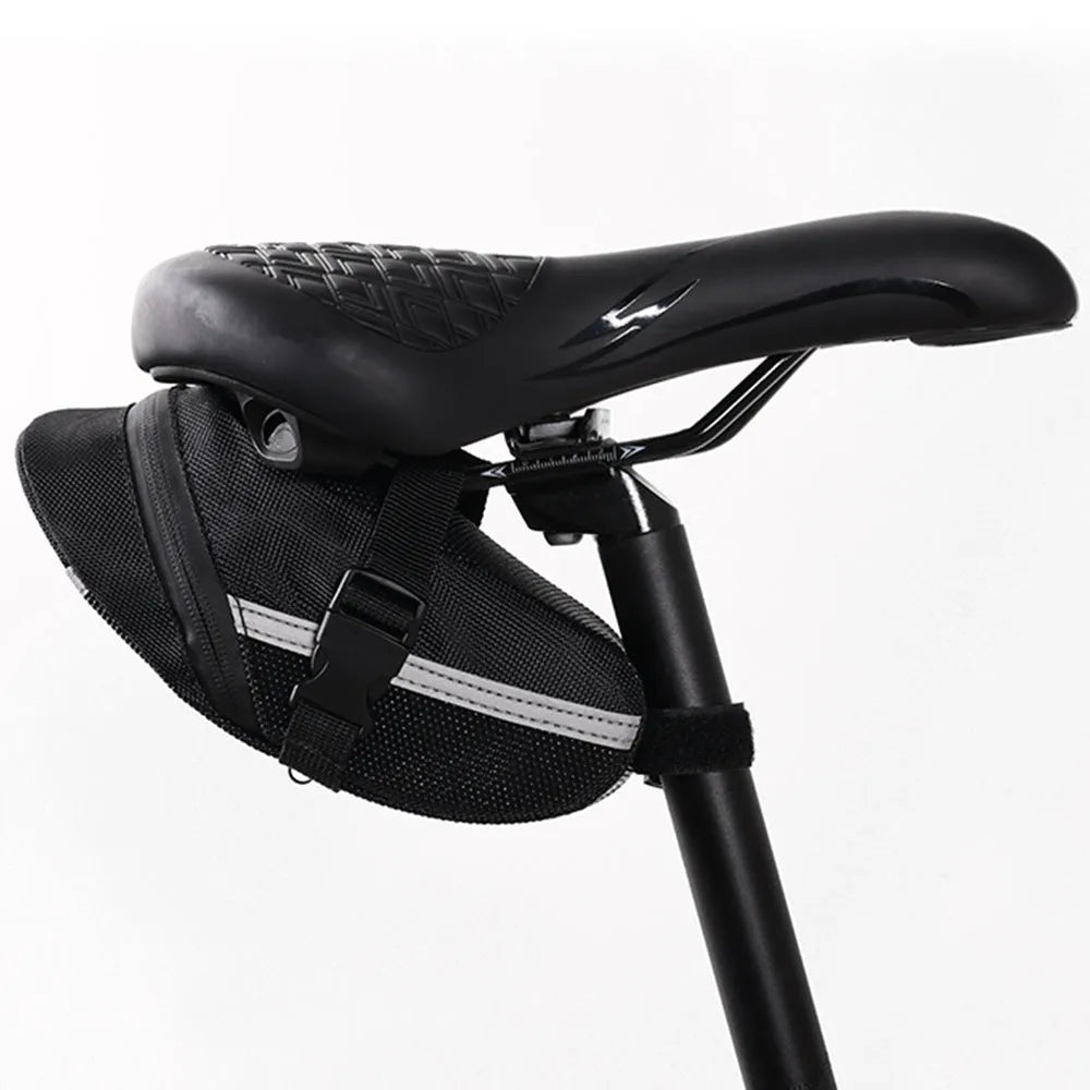 Black cycling quick release saddle bag with polyester construction mounted under bicycle saddle