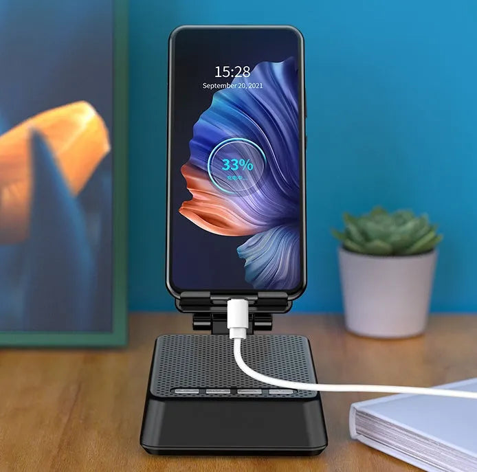 Black mobile phone stand with Bluetooth speaker on desk showing 135cm height and USB charging port