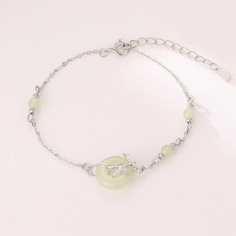 Women's Hetian jade bracelet with Peace Buckle clasp in antique style, made from 925 silver