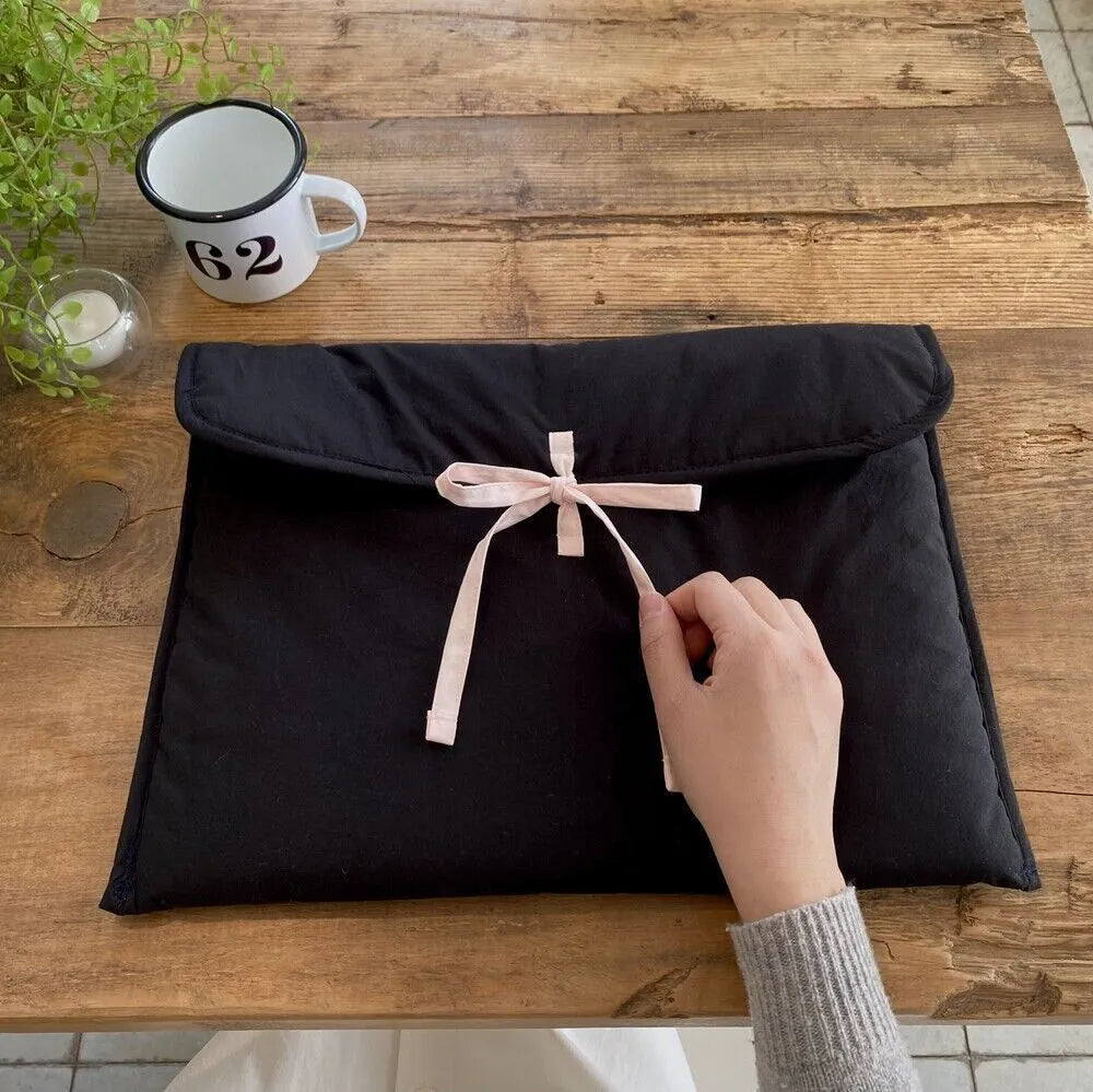 Women's black and white quilted computer bag with striped pattern and ballet bow for 11-inch or 14-inch laptops