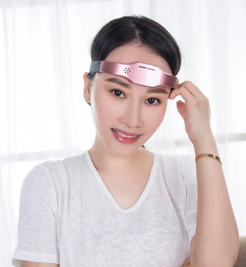 Wireless head massager in black or pink with adjustable fasteners, 110g, USB rechargeable, 3 modes and 9 intensities.