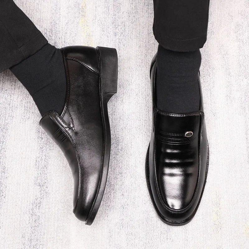 Men's black plus size casual shoe with a leather toe holder and rubber sole, shown from the side.