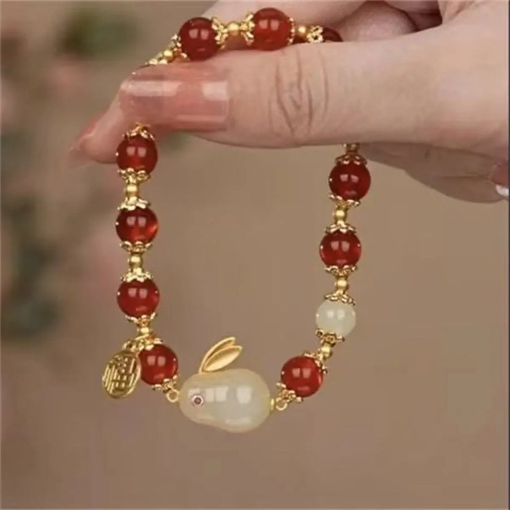 Rabbit motif bracelet with peace buckle clasp made from glass and coloured glaze