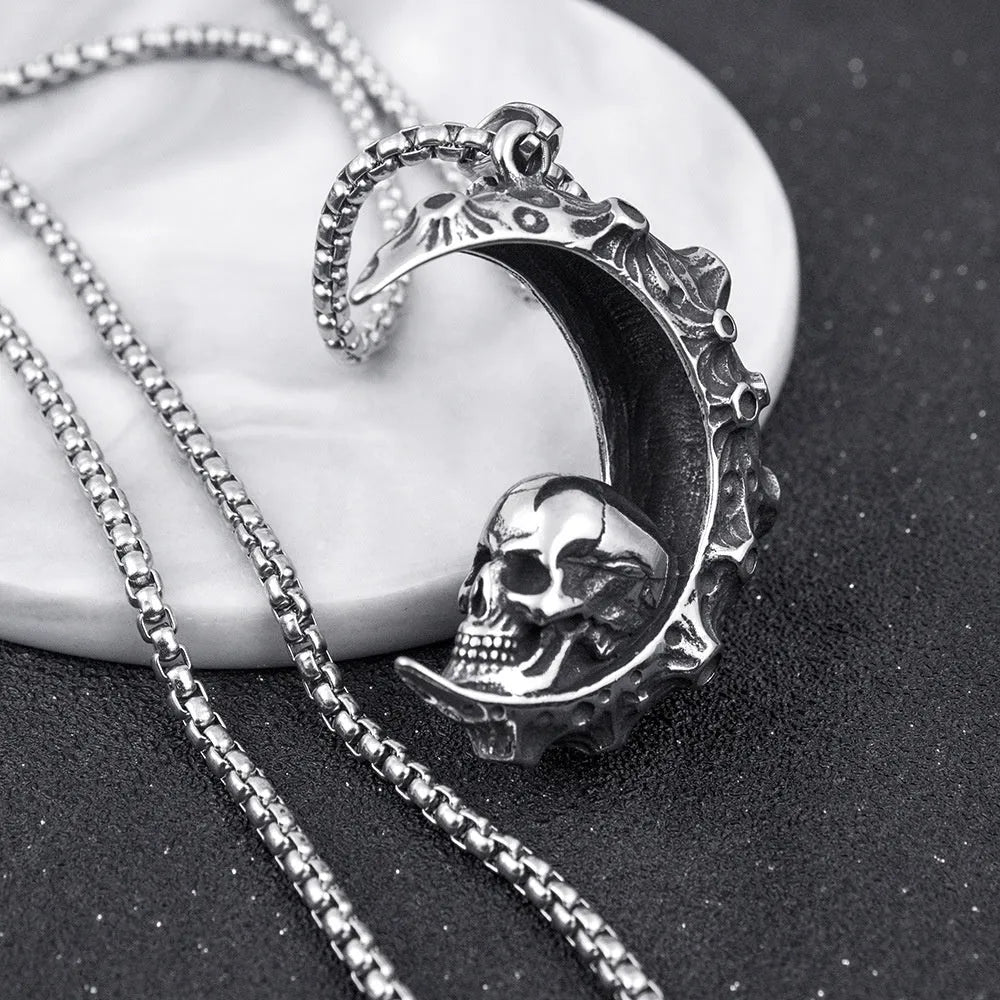 Men's silver alloy skull pendant necklace on a chain, showing design options like dagger, moon, and grimace.