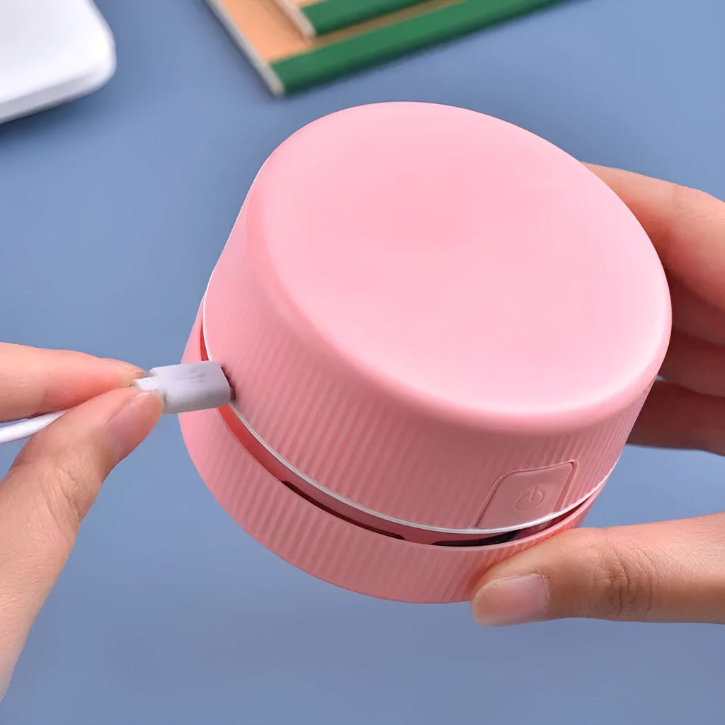 Portable mini desktop vacuum cleaner in pink or blue for pencil eraser chip cleaning