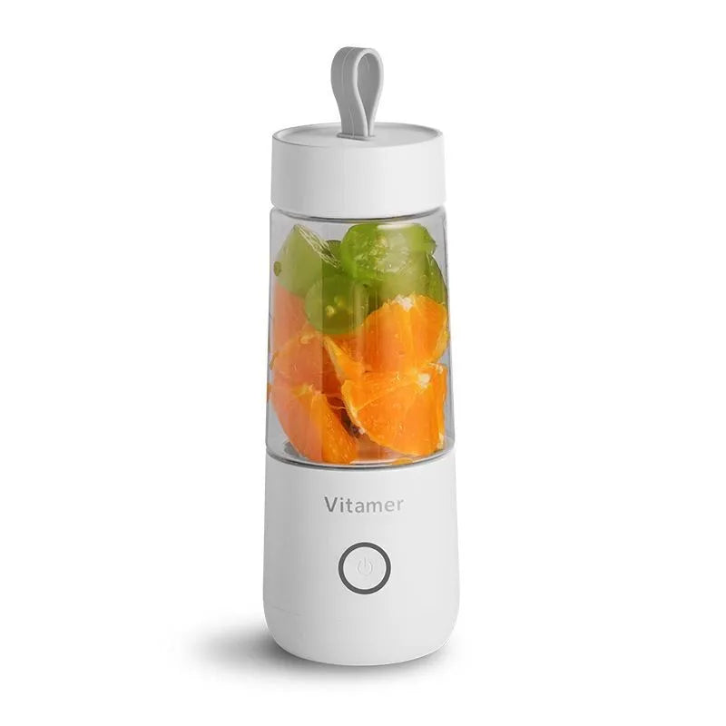 White portable USB rechargeable blender with 350ml cup and silicone handle on a table.
