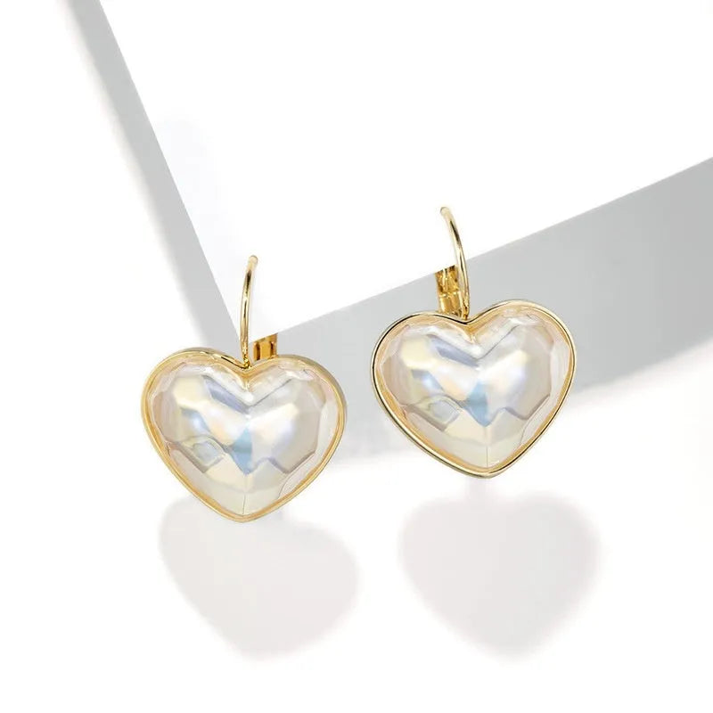 Gold coloured summer love design alloy ear clips for women.