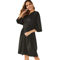 Black A-line dress with elastic waist and cinched belt, mid-length skirt, long sleeves