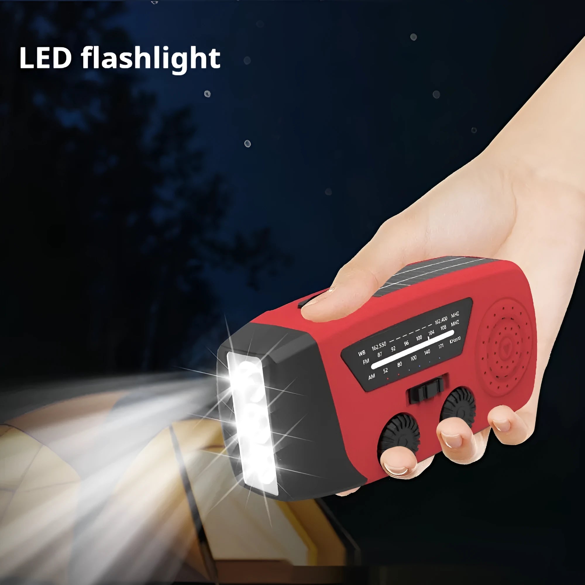 Red rechargeable handheld torch and radio with wrist strap and USB charging cable.