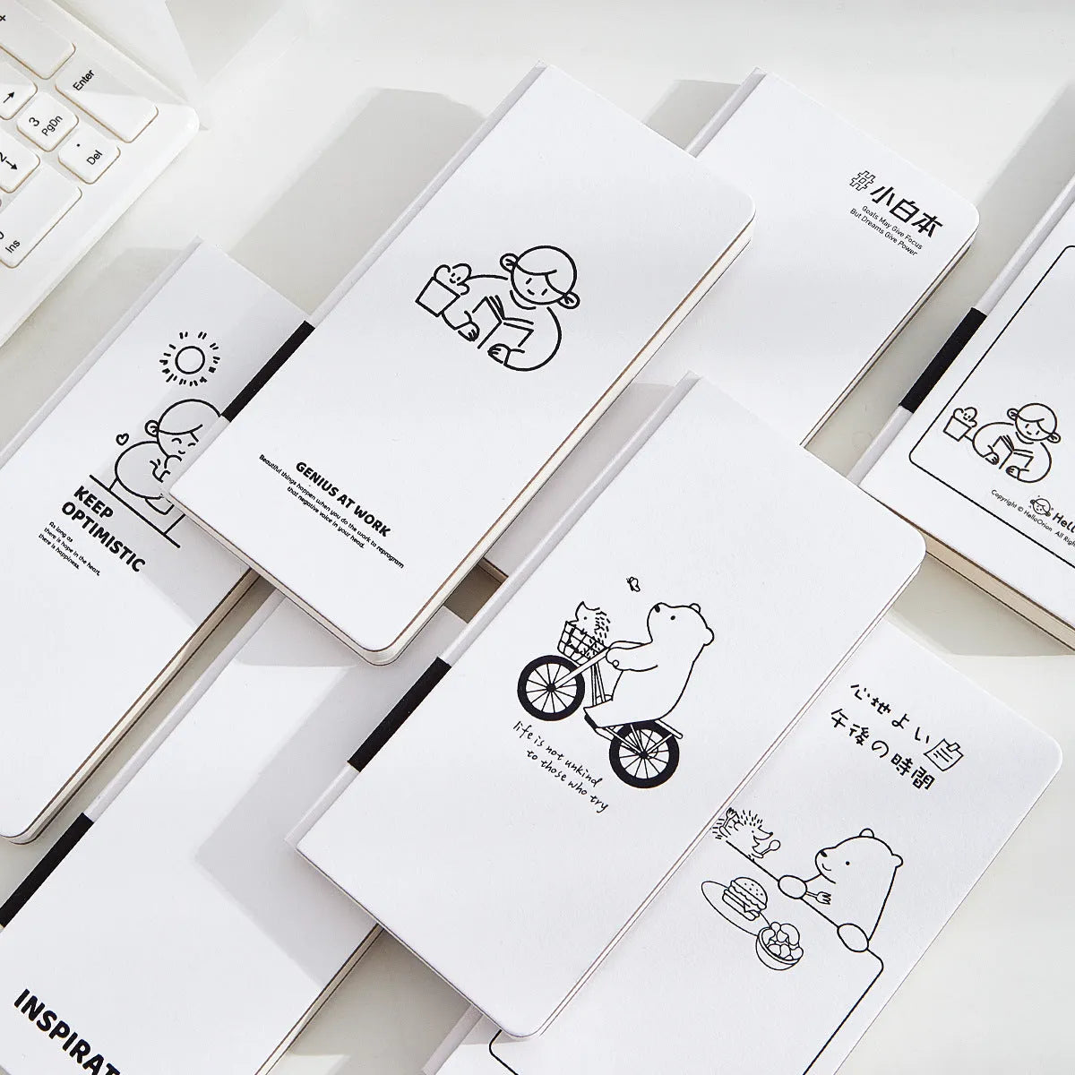 A5 grid notebook with paper cover, 192 pages of 80gsm paper, 1mm lines, and included stickers.