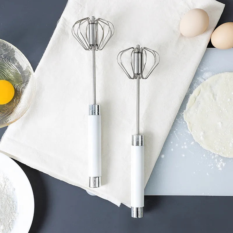 Semi-automatic stainless steel egg beater whisk with hand pressure rotating mechanism in silvery or white colour