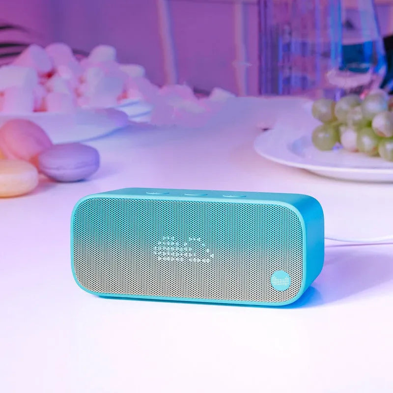 Elf sugar cube AI smart speaker in blue colour showing compact 15cm cube design with front speaker
