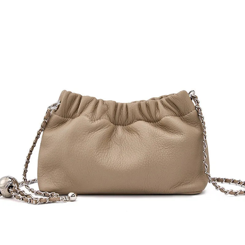 Women's genuine leather crossbody bag with chain strap in Black, Milky White, and Elephant Grey colours.