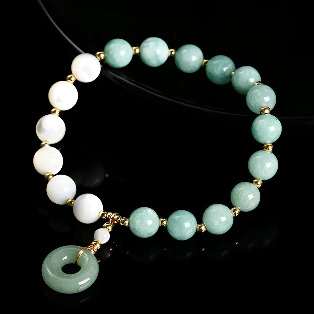 Blue Burma jade bracelet with 8mm round beads and a silver safety buckle clasp.