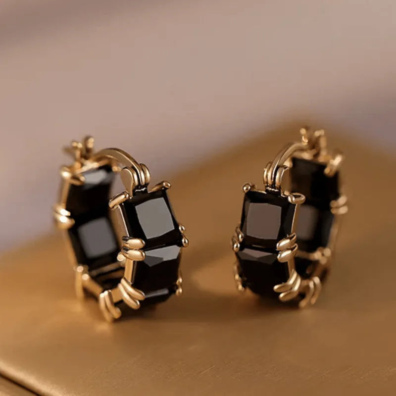 Geometric U-shaped zircon ear rings with electroplated gold finish on copper construction