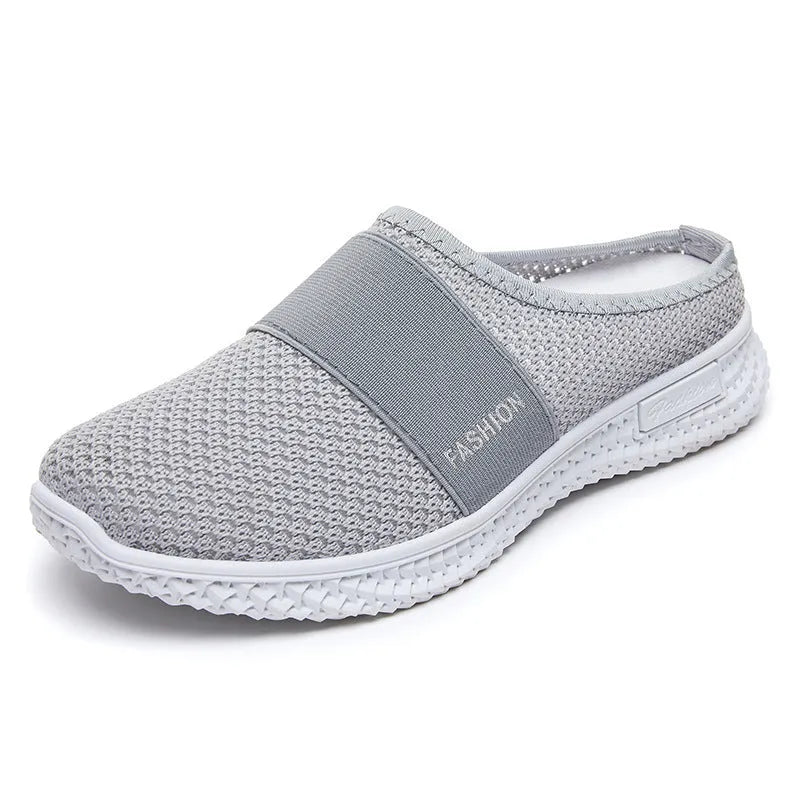 A pair of women's breathable casual flat shoes with a mesh upper and hollow-out design, shown in a choice of colours.