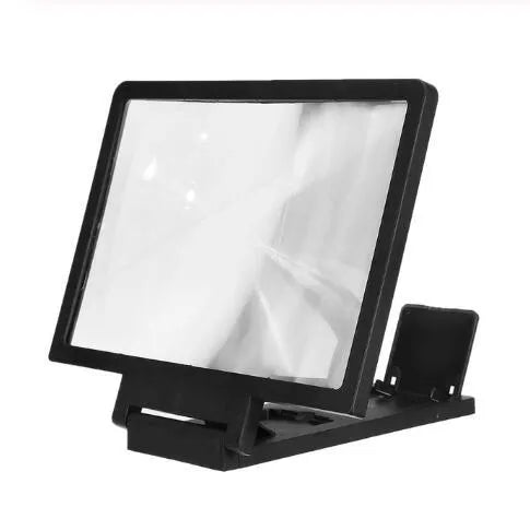 Black and white magnifying mobile phone stand on a desk for hands-free use.