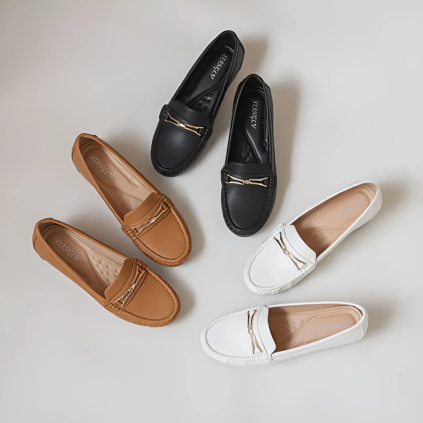 Casual height increase slip-on shoes in black with a round toe and low-top design.