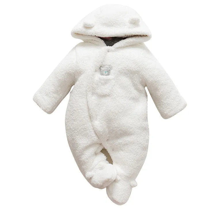 A baby wearing a soft brown cotton lamb-print jumpsuit with long sleeves.