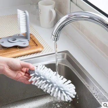 Grey rotating double-head cup cleaning brush with suction cups for wall mounting