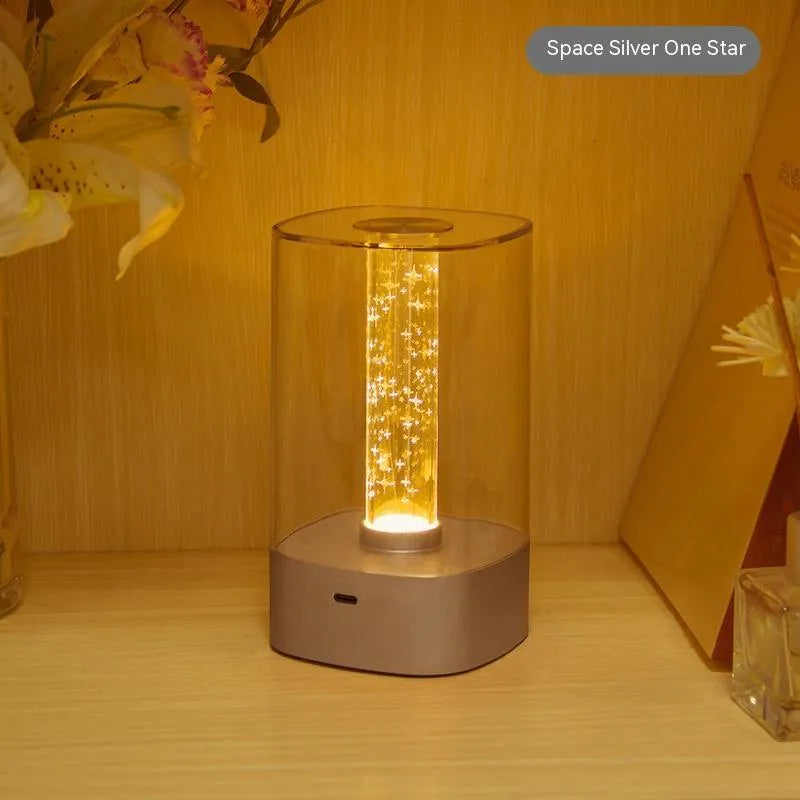 Rose gold touch-control LED bedside lamp with decorative conch pattern and USB charging cable