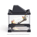 Transparent glass cylinder habitat for lizards and turtles on a white background.