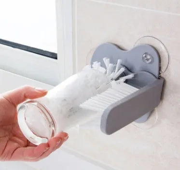 Grey rotating double-head cup cleaning brush with suction cups for wall mounting
