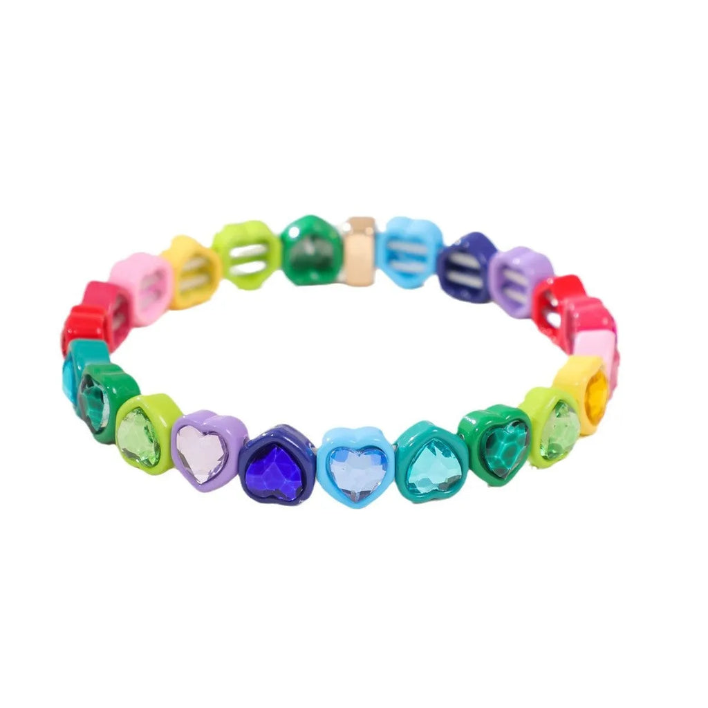 Colourful enamel heart charm on a stretch alloy bracelet.