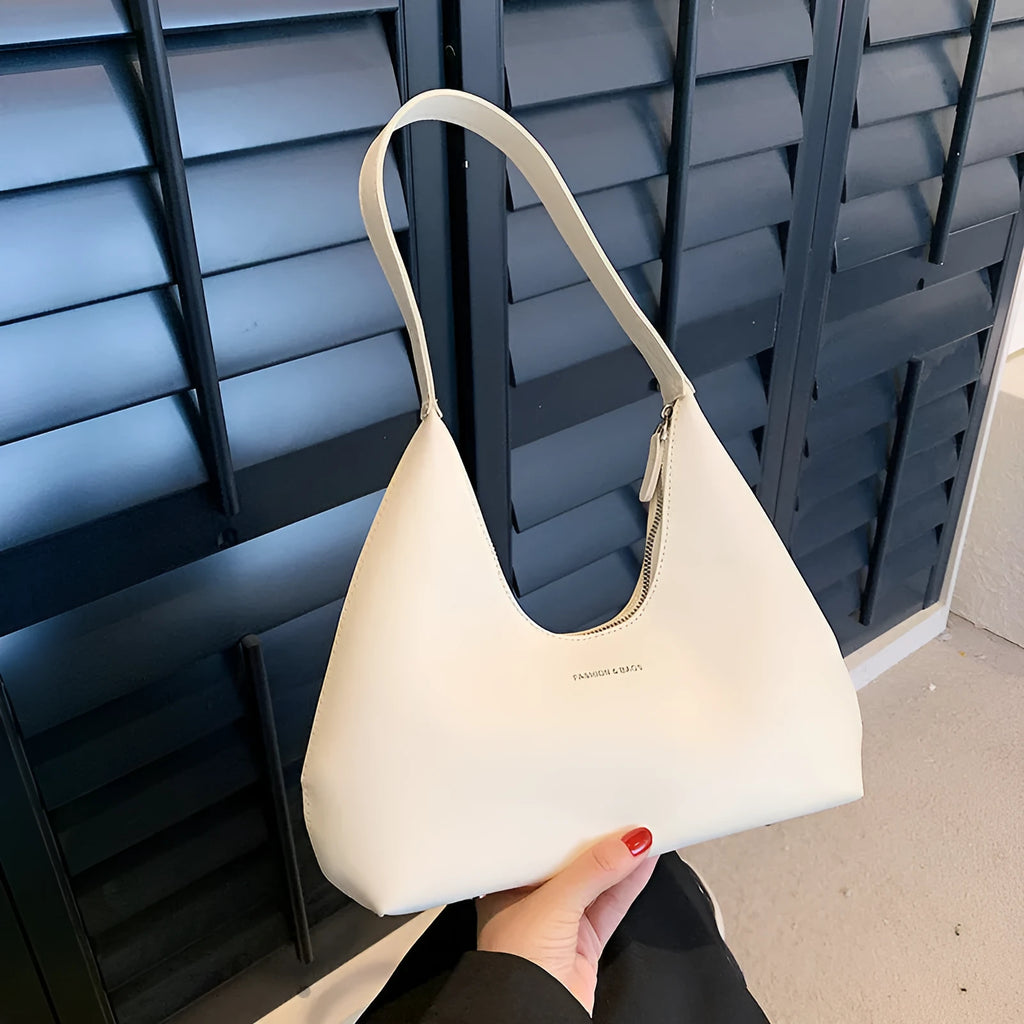 PU leather retro shoulder handbag in pillow shape with stitching details and single strap