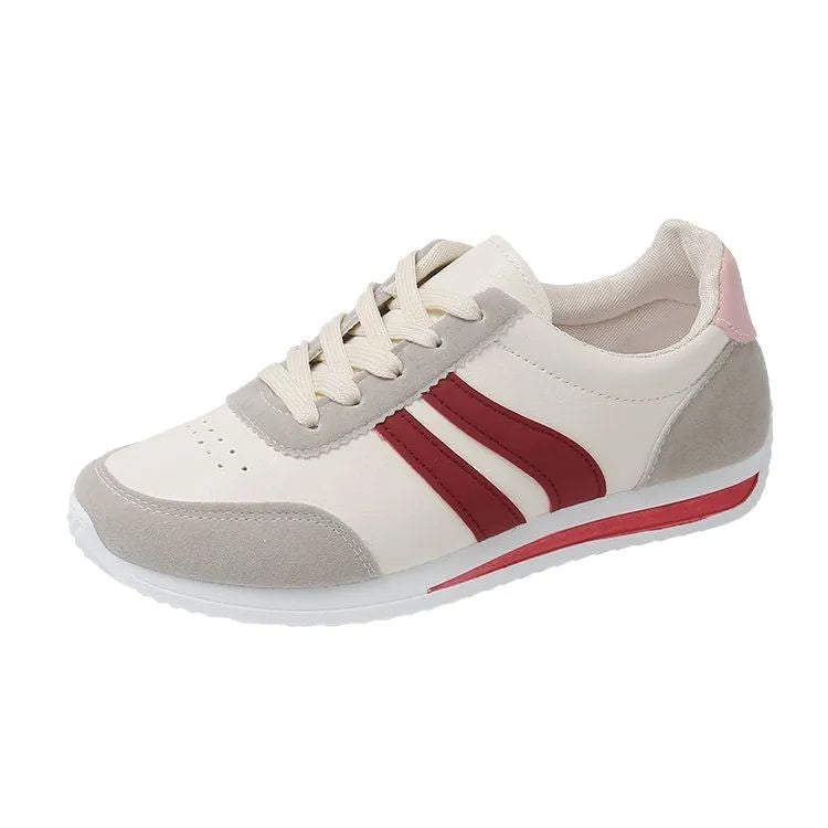 Blue and red low-top lace-up running sneakers with a round toe and rubber sole