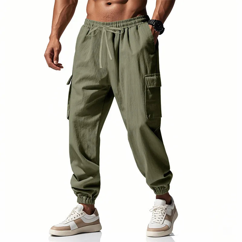 Men's loose-fit linen trousers with ankle ties and multiple pockets in solid colours