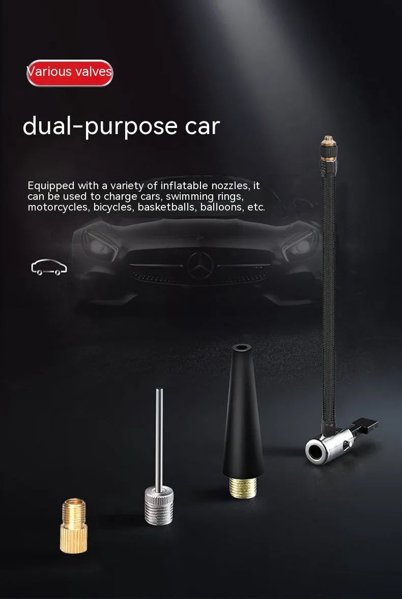 Red and black portable car tyre air pump with display, nozzles, and power cables on a table.