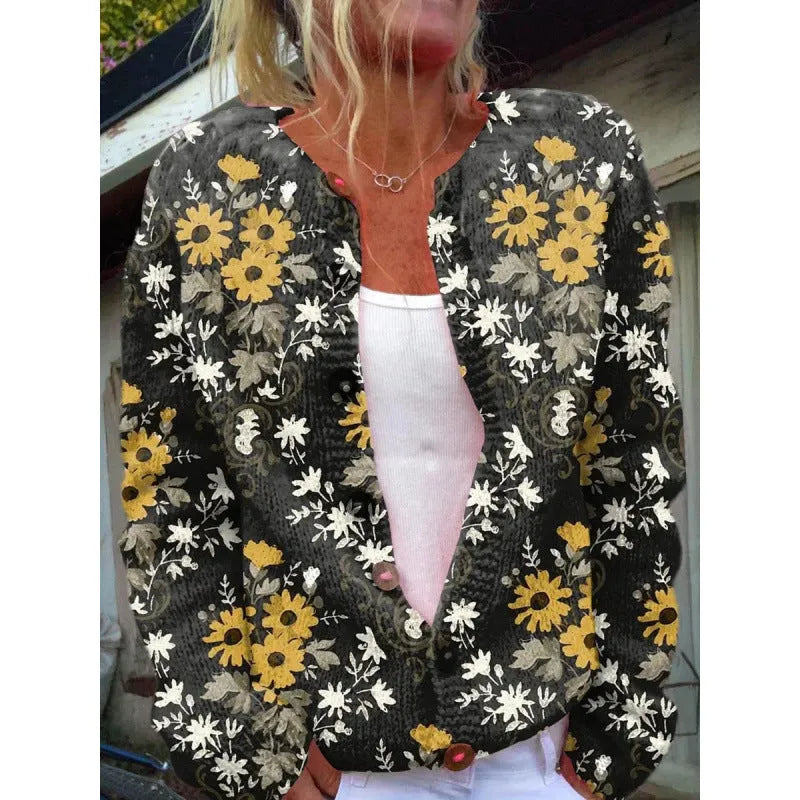 Yellow cardigan knitted coat with a raised 3D digital print pattern, shown on a hanger.