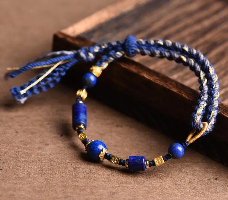 Hand-woven DIY watch band bracelet made from flexible wire in an ethnic lapis lazuli style.