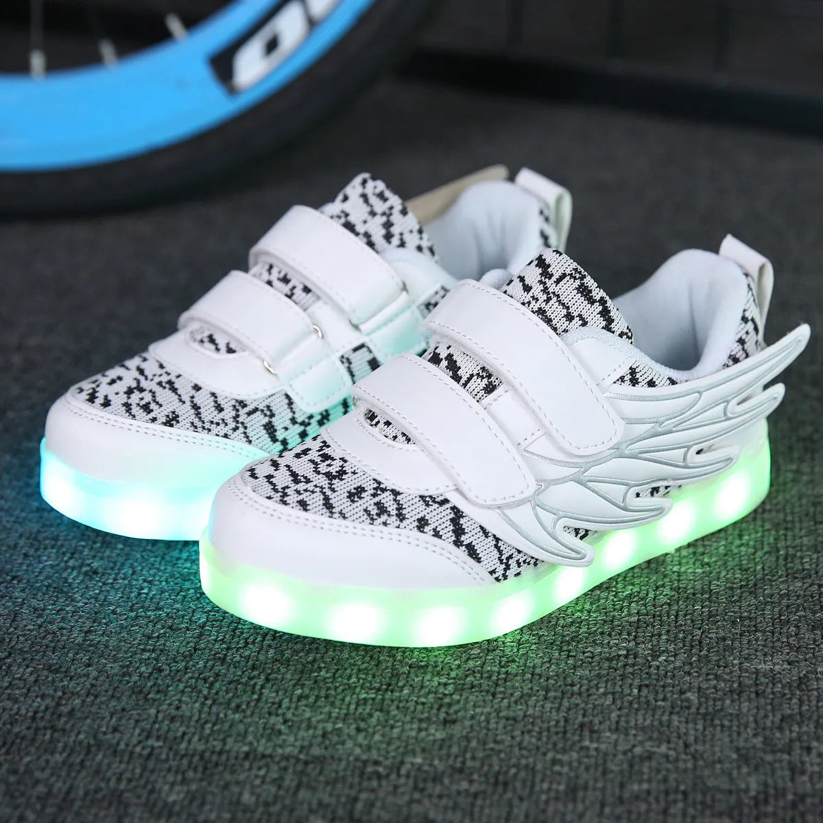 Children's LED light-up sneakers in plum red or white with USB charging port and hidden switch for light modes