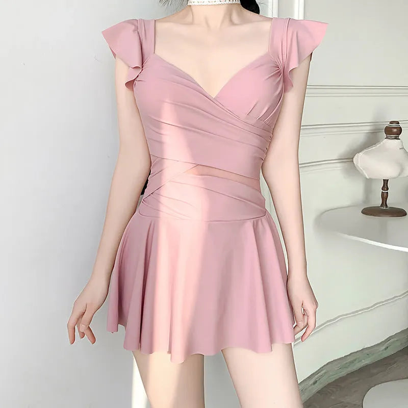 Women's solid colour one-piece French swimsuit in milk silk fabric shown in black, green, and pink.