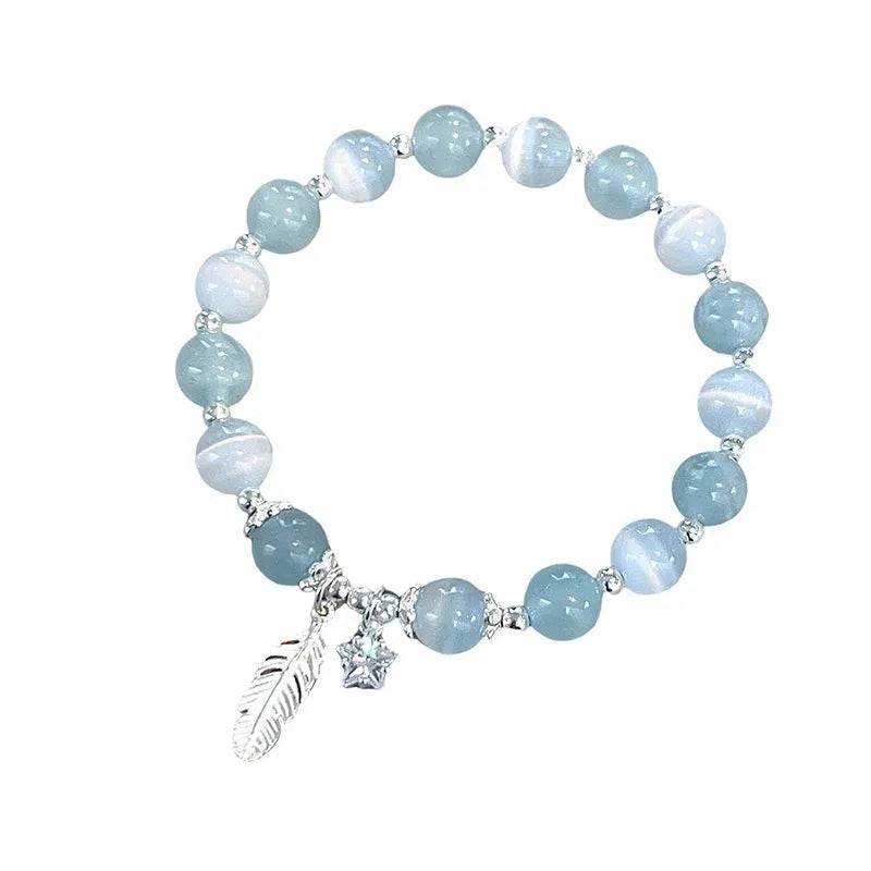 Korean style glass bracelet with feather XINGX blue moonlight colour and eight Awn star decorative elements