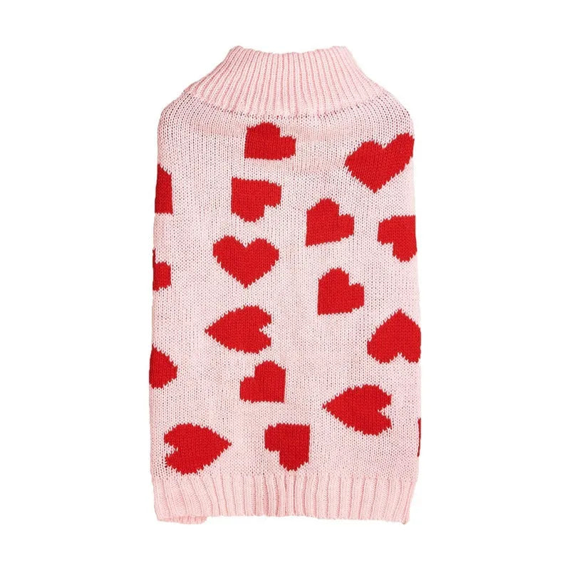 Red love heart dog sweater with bow decoration on a small breed pet, showing acrylic knit and fit