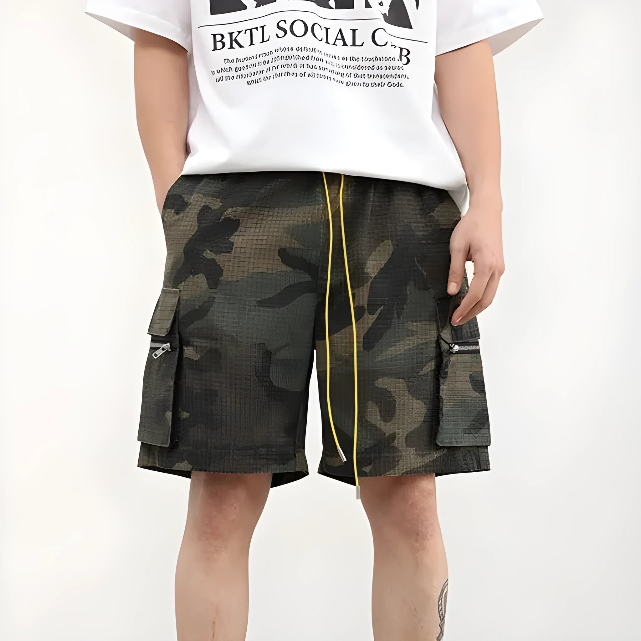 Men's camouflage multi-pocket work shorts showing cropped length and pocket details