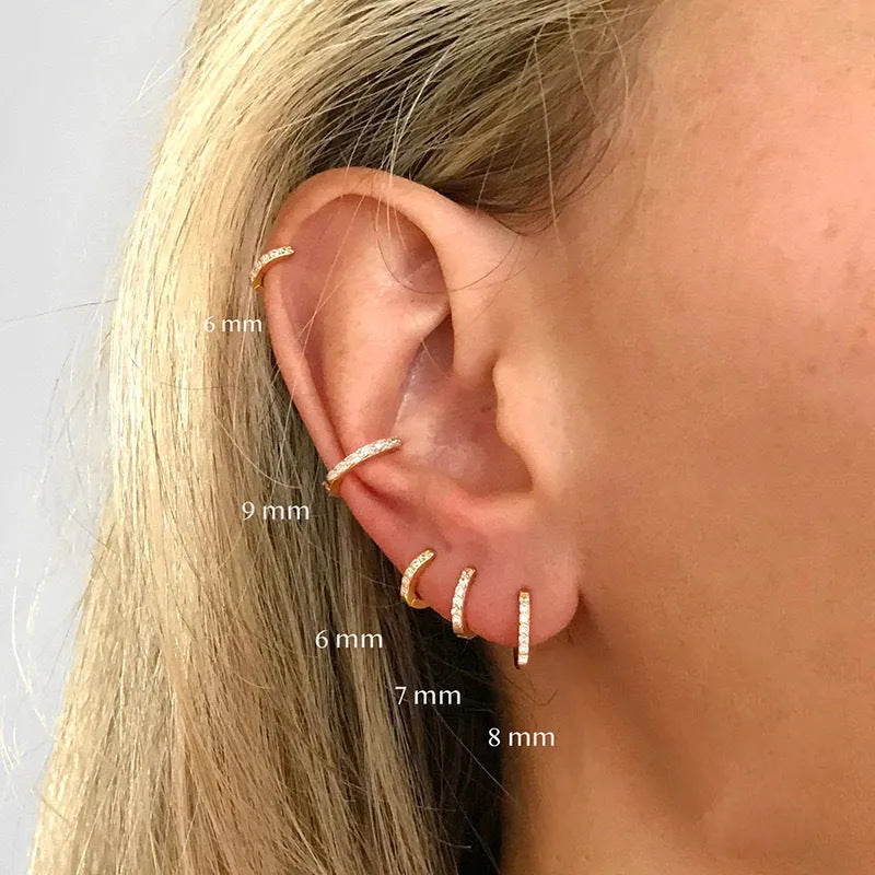Circle zircon perforated stud earrings in gold, rose gold, silver colours with geometric design