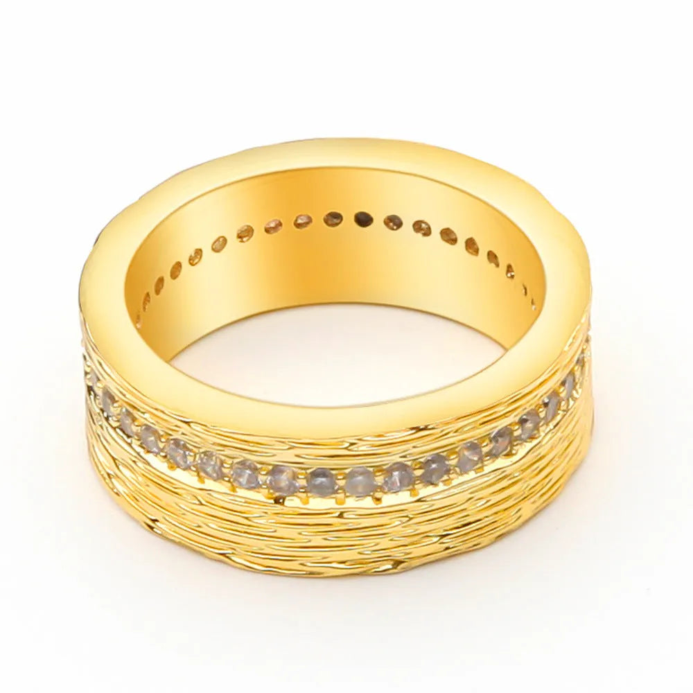 Gold geometric women's ring with zircon stone, showing clean lines and symmetrical design on hand