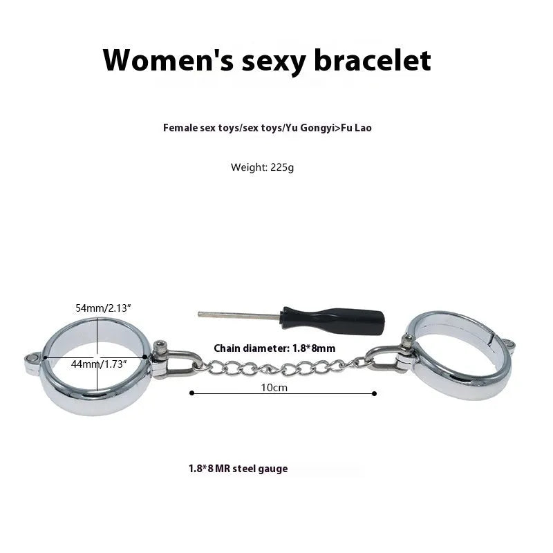 Silver zinc alloy handcuffs and footcuffs set with stainless steel chain linking on black background