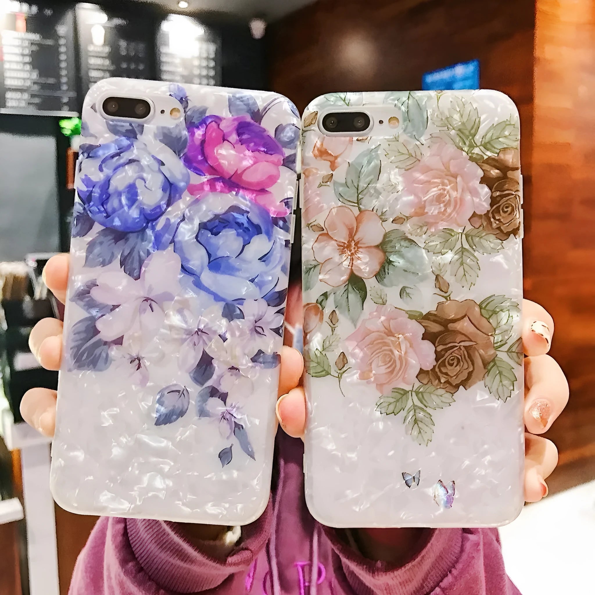 Soft TPU iPhone case with a rose flower design on the back, shown in brown.