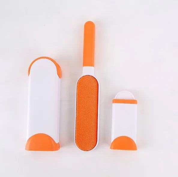 Blue reusable pet hair removal comb with double-sided flannel brush next to its self-cleaning base unit.
